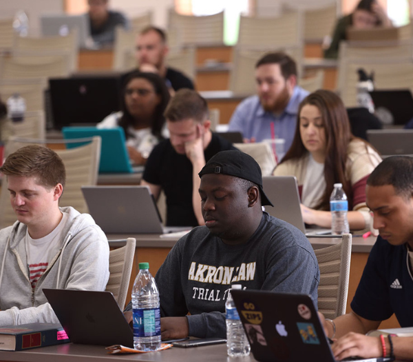 People typing on computers.